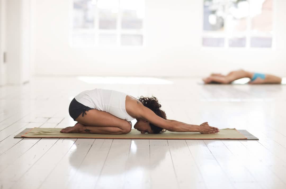 woman child's yoga pose