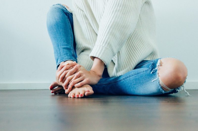 Woman in ripped jeans exposed knees